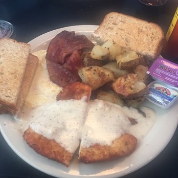 District 7 Grill - Chicken fried chicken with gravy, two eggs, thick cut bacon, country potatoes, and toast. - Breakfast & Brunch Near Me - Houston, Texas District 7 Grill - Chicken fried chicken with gravy, two eggs, thick cut bacon, country potatoes, and toast. - Breakfast & Brunch Near Me - Houston, Texas