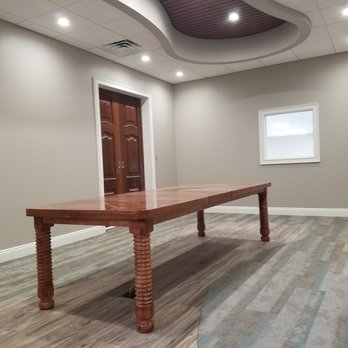 RCM Interiors - a conference room with a wooden table - General Contractors Near Me - Panama City Beach, Florida RCM Interiors - a conference room with a wooden table - General Contractors Near Me - Panama City Beach, Florida