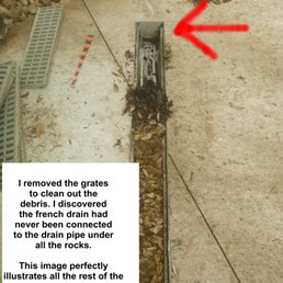 red arrow shows the downhill end of channel drain buried in driveway. No outlet!! red arrow shows the downhill end of channel drain buried in driveway. No outlet!!