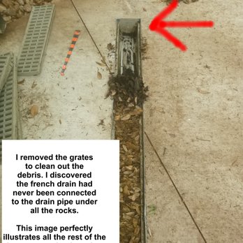 Morningstar Landscaping - red arrow shows the downhill end of channel drain buried in driveway. No outlet!! - Landscaping Near Me Morningstar Landscaping - red arrow shows the downhill end of channel drain buried in driveway. No outlet!! - Landscaping Near Me