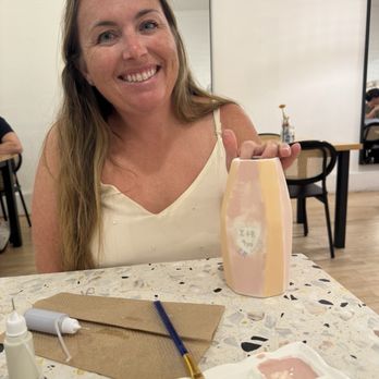 Kitsch Studios - Vase before it was finished. Clean paint pallets and paint pens for writing! - Art Classes Near Me - Fullerton, California