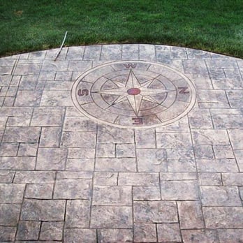 Steve's Construction - Stamped concrete patio with a compass on the East side - Snow Removal Near Me - Waterford, Michigan