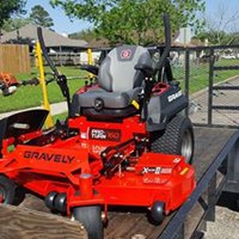 Powerhouse Lawn Care - a red mower on a trailer - Landscaping Near Me Powerhouse Lawn Care - a red mower on a trailer - Landscaping Near Me