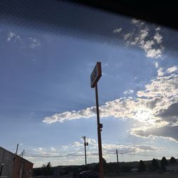 Juicy Peach Espresso - The tall sign in front of other businesses before you reach the drive-thru. 10.4.2025
