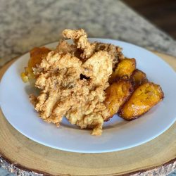 700 Isles Cafe - Succulent Bahamian Cracked Conch Dinner served with Peas- N- Rice, Fried Sweet Plantain & Bahamian Baked Macaronni & Cheese