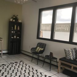 Kula Yoga & Wellness - Place your belongings in baskets and on wall hooks in the reception area. Check out the local artists' work we sell in the studio.