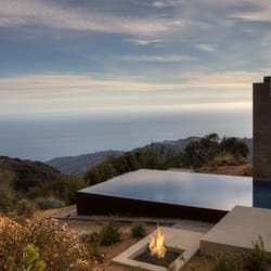 Aquatic Technology Pool & Spa - Vanishing edge pool finished with glass tile mosaics, gas fire feature, Malibu, California