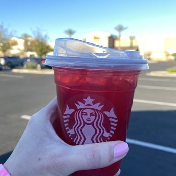 Starbucks - a hand holding a cup of red drink - Coffee & Tea Near Me - Mesa, Arizona Starbucks - a hand holding a cup of red drink - Coffee & Tea Near Me - Mesa, Arizona