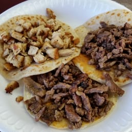 Pollo Asado on flour (top left), Carne Asada on flour (top right), Carne Asada on corn (middle). Very good street tacos! I was impressed! Pollo Asado on flour (top left), Carne Asada on flour (top right), Carne Asada on corn (middle). Very good street tacos! I was impressed!