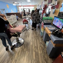 Corky's Cuts 4 Kids - My daughter chose the pink car and Moana 2 on her TV