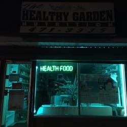 Healthy Garden Nutrition Center - Store front at nite.