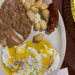 Taqueria Y Tienda Mexicana Los Primos - 2 eggs over easy, beans, very tasty taters and bacon. Could use another strip or 2 of bacon, but it was cooked perfectly.