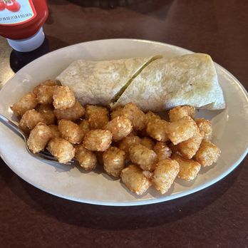 Shuckers Raw Bar - Shuckers seafood wrap and tater tots - Bars Near Me - Myrtle Beach, South Carolina