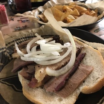 Joe's Barbeque - Sliced brisket sandwich and homemade chips. - Barbeque Near Me - Alvin, Texas