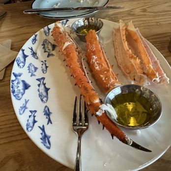 Plank Provisions - King Crab legs waiting to be eaten, Served warm with Butter - Seafood Near Me - Fort Worth, Texas