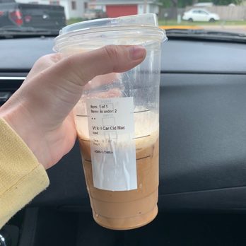 Starbucks - a hand holding a cup of iced coffee - Coffee & Tea Near Me - Eau Claire, Wisconsin