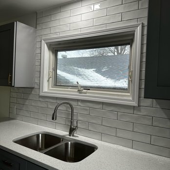 The Last Floor - a kitchen with a sink and a window - Flooring Near Me