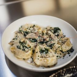 Trattoria Valona - Large ravioli with short rib Ragu served with spinach and mushroom in a white cream sauce!