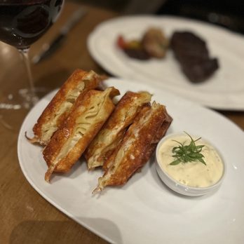 The Victor - a plate of food and a glass of wine - Steakhouses Near Me - Vancouver, British Columbia The Victor - a plate of food and a glass of wine - Steakhouses Near Me - Vancouver, British Columbia