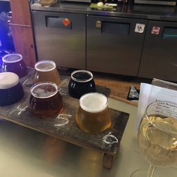 Flight of beer & a glass of white