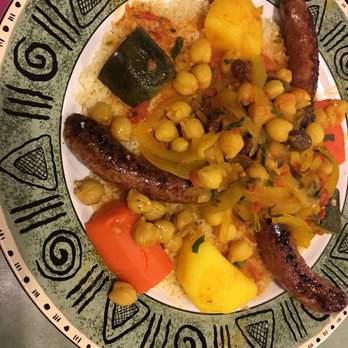 Cafe Paprika - Homemade Moroccan sausage over couscous. The soup and stew also deliciously uniquely Moroccan. - Moroccan Near Me - Aurora, Colorado