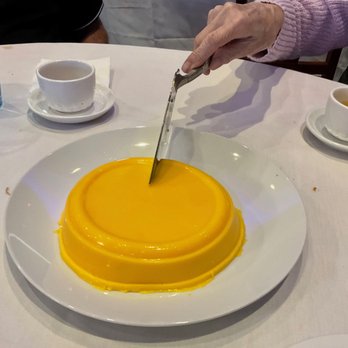 Wah Wing Restaurant - .. Mom's first cut of the mango pudding. - Chinese Near Me - Port Coquitlam, British Columbia Wah Wing Restaurant - .. Mom's first cut of the mango pudding. - Chinese Near Me - Port Coquitlam, British Columbia