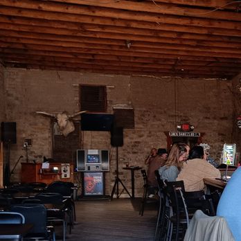 Doc Holliday's Saloon - people sitting at tables - Bars Near Me - Tombstone, Arizona