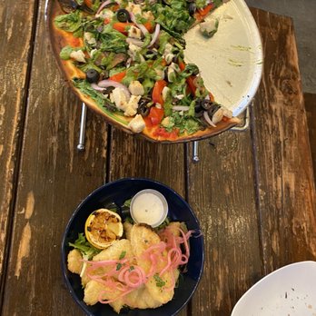 The Privateer Coal Fire Pizza - Vegan & gluten-free Blockhead Pie, w/ a plate of Vegan Calamari. - Pizza Near Me - Oceanside, California The Privateer Coal Fire Pizza - Vegan & gluten-free Blockhead Pie, w/ a plate of Vegan Calamari. - Pizza Near Me - Oceanside, California