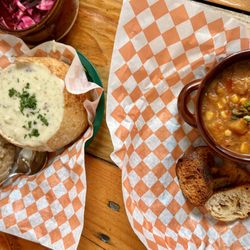 Panacea - Classic New England Clam Chowder in a sourdough bread bowl on the left and a smoky corn vegan chowder on the right * Maine Food *