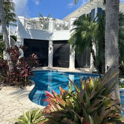 All Hurricane Services - Bespoke hurricane impact windows and multi-slide doors securing a luxury Boca Raton estate. NOA-approved architectural glazing.