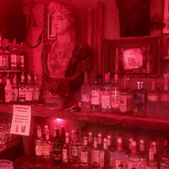 A-House - a shelf full of liquor bottles - Gay Bars Near Me - Provincetown, Massachusetts