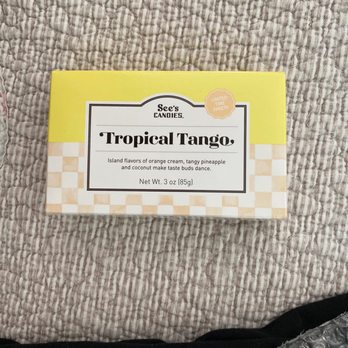 See's Candies - Seasonal flavor of orange and pineapple buttercream white chocolate rolled in coconut - Candy Stores Near Me - Simi Valley, California