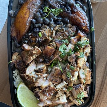 The Smoking Kettle - La Cubana. Garlic Citrus Flame-Grilled Chicken served with garlic white rice, black beans & sweet plantains - Caribbean Near Me - Upland, California