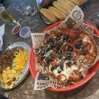 Bubba's Sports Bar - Individual Combination Pizza, Nacho Salad, garlic bread sticks. - Sports Bars Near Me - Warrenton, Oregon Bubba's Sports Bar - Individual Combination Pizza, Nacho Salad, garlic bread sticks. - Sports Bars Near Me - Warrenton, Oregon
