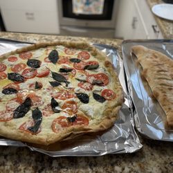 Italianos NY Pizza - Large Cheese Calzone and a 22 inch Bianca Pizza with  and basil