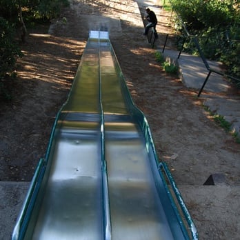 Esmeralda Street Slides - Looking down the slides...note the small runoff at the end. - Playgrounds Near Me - San Francisco, California Esmeralda Street Slides - Looking down the slides...note the small runoff at the end. - Playgrounds Near Me - San Francisco, California