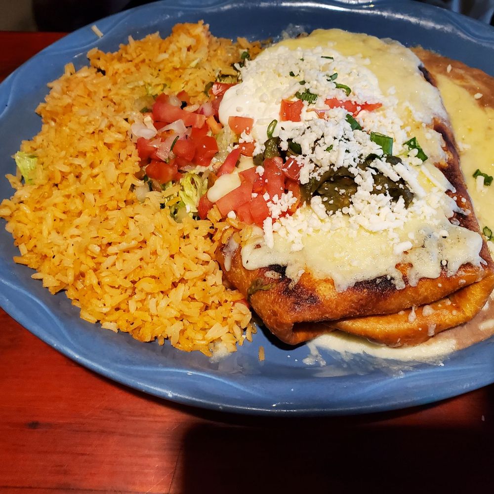 Sagebrush Cantina - The Outrageous Chimichanga with rice and refried beans. Also several meals worth. - Mexican Near Me - Lake Orion, Michigan Sagebrush Cantina - The Outrageous Chimichanga with rice and refried beans. Also several meals worth. - Mexican Near Me - Lake Orion, Michigan