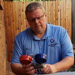 Comfort Airworks - Me adjusting a refrigerant charge on an install