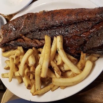 Cheddar's Scratch Kitchen - Whole rack of bbq ribs, under a layer of bbq sauce, meat was flavorless! - American Near Me - Lutz, Florida