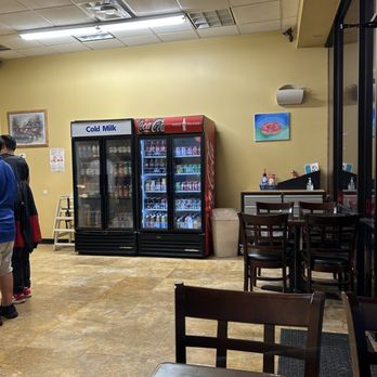 Mr Donut-Kolaches & Bakery - a man and a woman standing in front of a vending machine - Donuts Near Me - Houston, Texas Mr Donut-Kolaches & Bakery - a man and a woman standing in front of a vending machine - Donuts Near Me - Houston, Texas