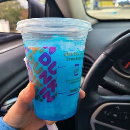  a blue drink in a plastic cup