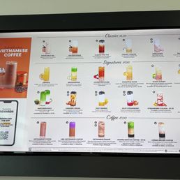 Menu - A menu board from a Vietnamese coffee shop lists drinks including traditional and signature beverages, with prices and descriptions.