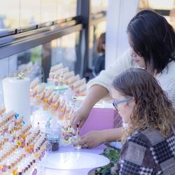 Crème de la Crème Beauty Lounge - One of our clients creating a custom-blended Parfum Oil. Hat made her perfume oil so unique was the surprising addition of mint mojito!