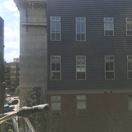 Picture- the "dog park" that we were told would be outside the courtyard is now a very loud 9 stories and growing parking ramp construction. Picture- the "dog park" that we were told would be outside the courtyard is now a very loud 9 stories and growing parking ramp construction.