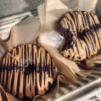 Amor Plant Based - Two spectacular chocolate latte doughnuts. - Caterers Near Me Amor Plant Based - Two spectacular chocolate latte doughnuts. - Caterers Near Me