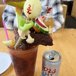 Doc's Sports Bar and Grill - Bloody Mary with Bacon, salami, olive, cheese, egg, celery, BBQ ribs, peppers, pickle, and veggies.