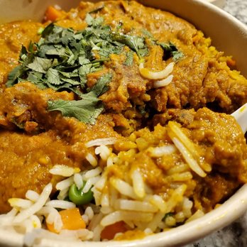 Munchkart - Vegetable maratha over vegetable pulao rice in an eco friendly to go container. - Fast Food Near Me - South Jordan, Utah