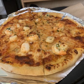 Uncle Momo - Seafood Pitza, not worth $16 (my boyfriend fixed the toppings that slid off and reheated it!) - Lebanese Near Me - Jersey City, New Jersey Uncle Momo - Seafood Pitza, not worth $16 (my boyfriend fixed the toppings that slid off and reheated it!) - Lebanese Near Me - Jersey City, New Jersey