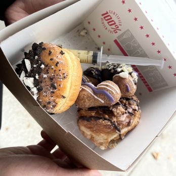 Bad Bakers - a hand holding a box of donuts - Donuts Near Me - Elk Grove, California