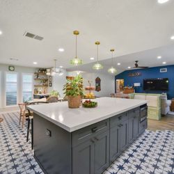 Smart Remodeling - Kitchen Remodeling Marble Island & Green Cabinets: Replaced the old white kitchen with a striking marble island and elegant green cabinets.